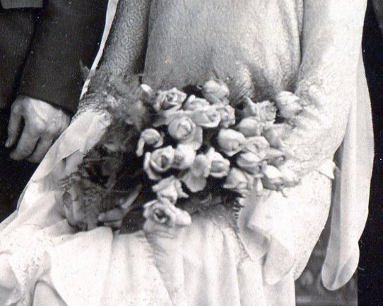 Bridesmaid's bouquet of long stem roses.