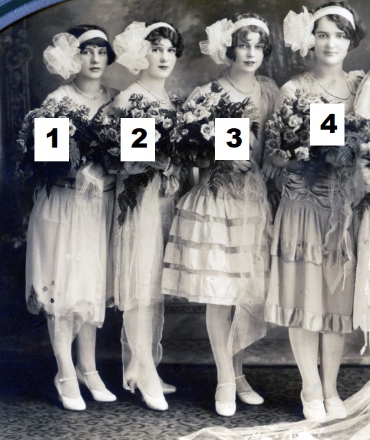 Bridesmaids' dresses and skirts are all different and end just below the knees.