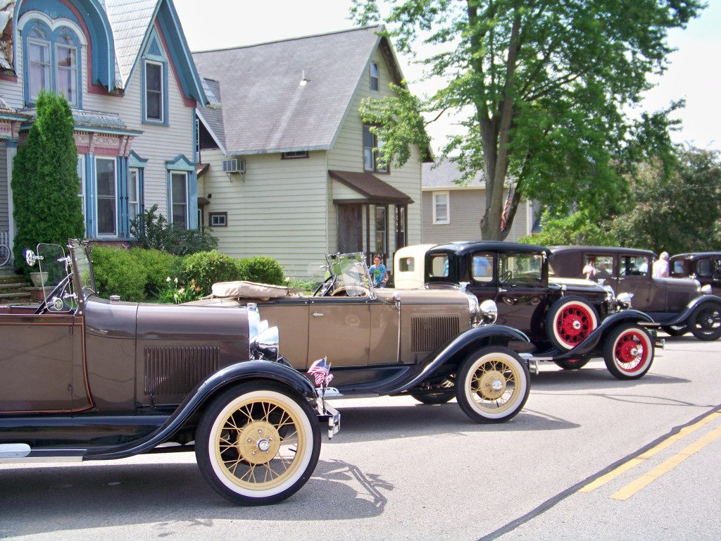 Model A Fords lined up on the street  for the Model A Days Car Show in Sharon, Wisconsin.