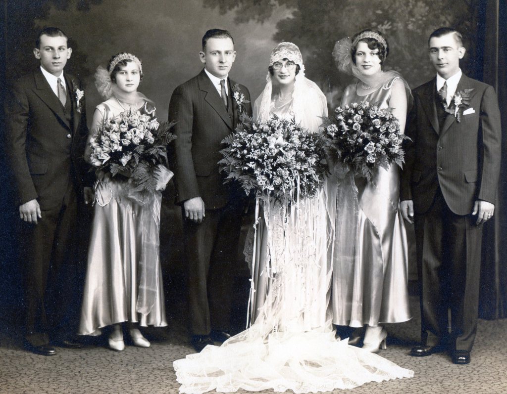 1930s wedding party with Bride, Groom, two bridesmaids ad two groomsmen.