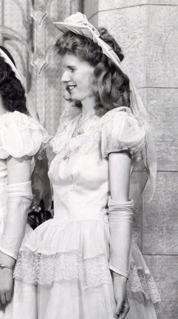 Close-up of Bridesmaid showing the faux sleeve of chiffon sliding down her arm.